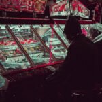 person playing on arcade machine