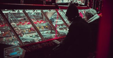 person playing on arcade machine